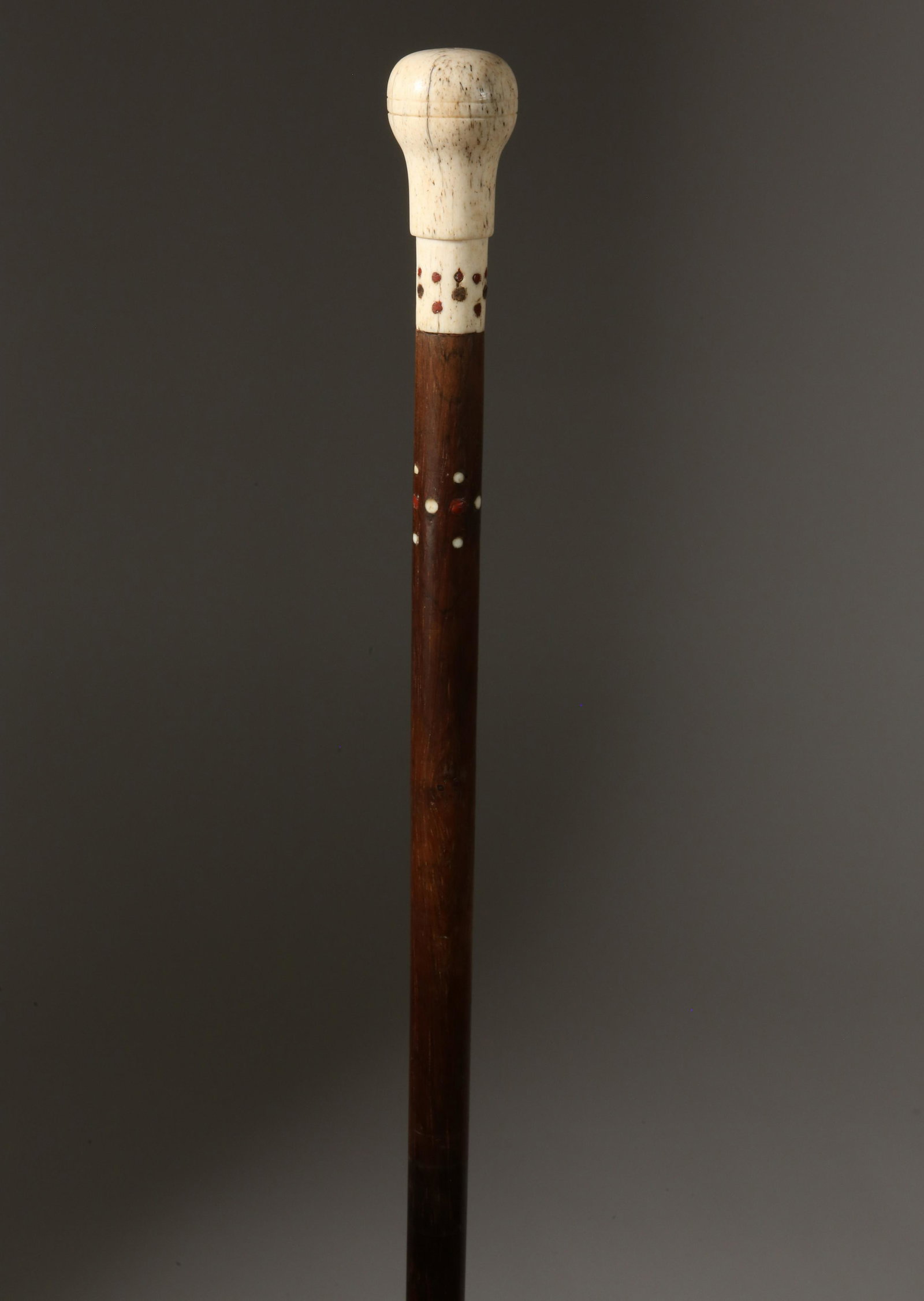 Turned Antique Whalebone Knob Walking Stick, 19th Century: Turned Antique Whalebone Knob Walking Stick, 19th Century, turned and scribed whalebone grip with wax accents on collar, tapering hardwood shaft with additional inlaid dot accents, ending in a whalebo