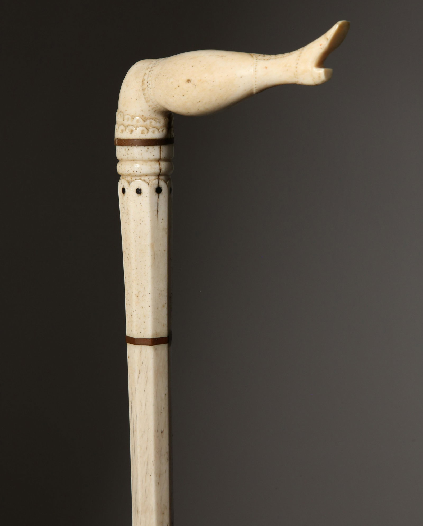 Whaleman Made Naughty Leg Cane, circa 1870: Whaleman Made Naughty Leg Cane, circa 1870, carved whalebone and scrimshawed naughty leg depicting a laced boot, garter and petticoat on a turned and paneled graduating whalebone shaft Length 33 in. P