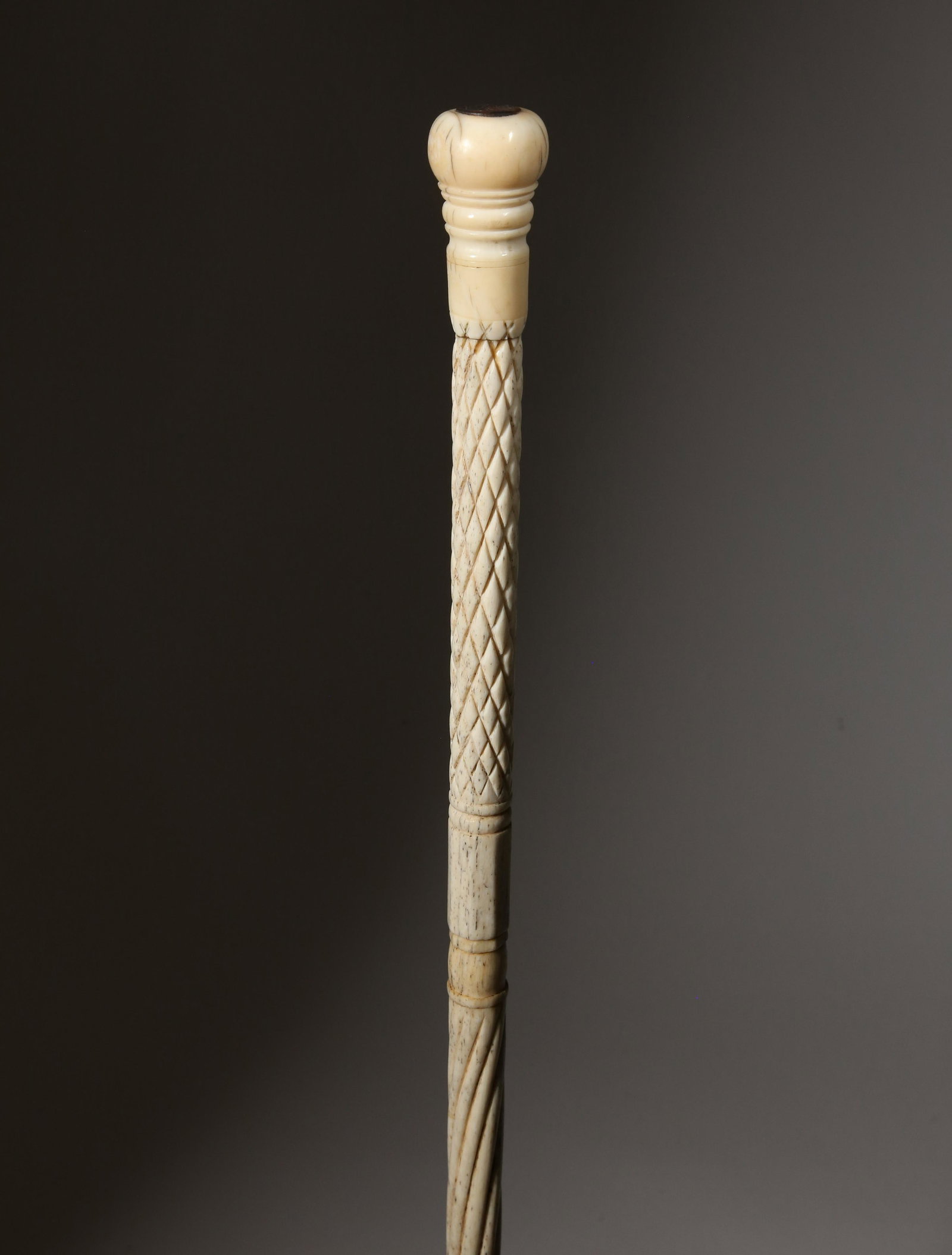 Whaleman Made Walking Stick, circa 1860: Whaleman Made Walking Stick, circa 1860, antique whale ivory knob, turned and inlaid grip, conforming whalebone hatch, ring panel and rope twist shaft, large brass ferrule Length 34.25 in. Provenance: