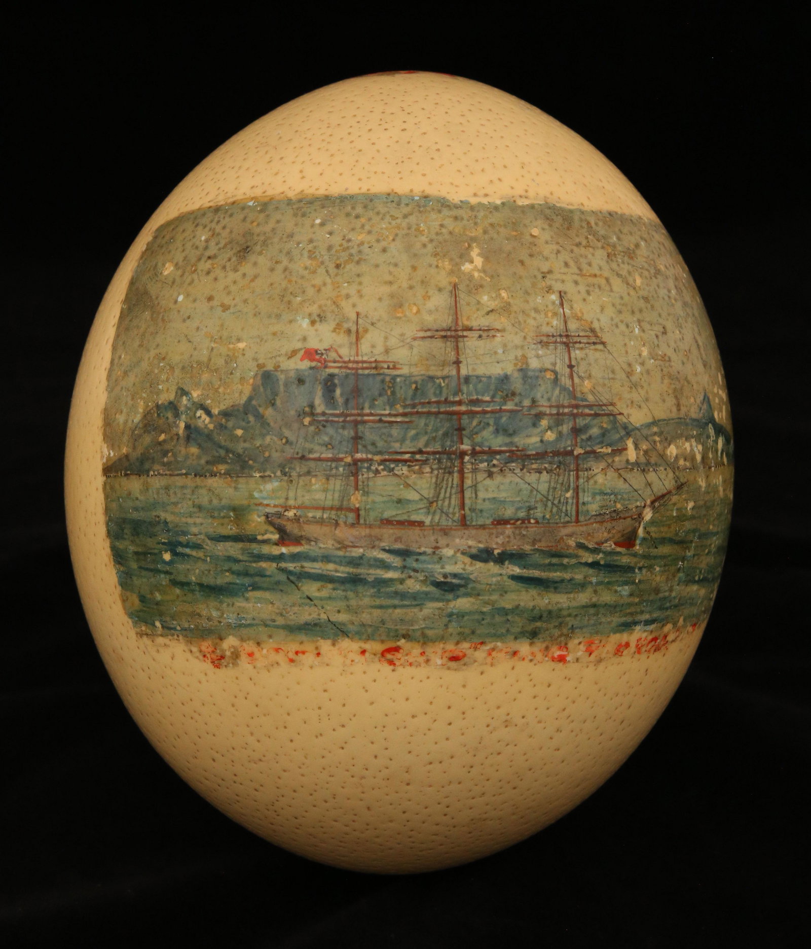 Hand Painted Ostrich Egg Depicting a British Frigate Off the Coast: Hand Painted Ostrich Egg Depicting a British Frigate Off the Coast, worn inscription Height 6 in. Width 5 in.