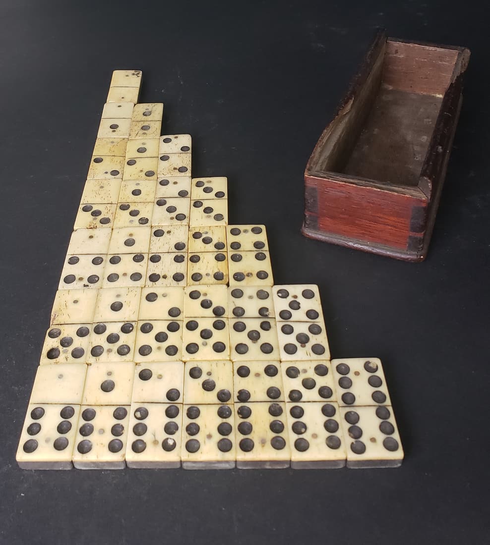 Boxed Set of Antique Sailor Made Bone and Ebony Dominoes, 19th century: Boxed Set of Antique Sailor Made Bone and Ebony Dominoes, 19th century, complete set, in antique dovetailed box, no lid. Box Height 1.5 in. Width 5.5 in. Depth 2 in.