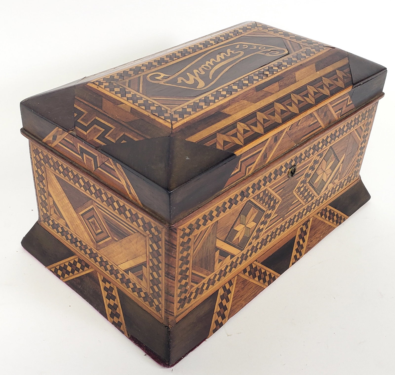 Vintage Multi-Wood Inlaid Jewelry Box: Vintage Multi Wood Inlaid Jewelry Box, with inlaid ribbon and dated nameplate, "Yvonne 1930" Height 6.5 in. Width 11.5 in. Depth 7 in.