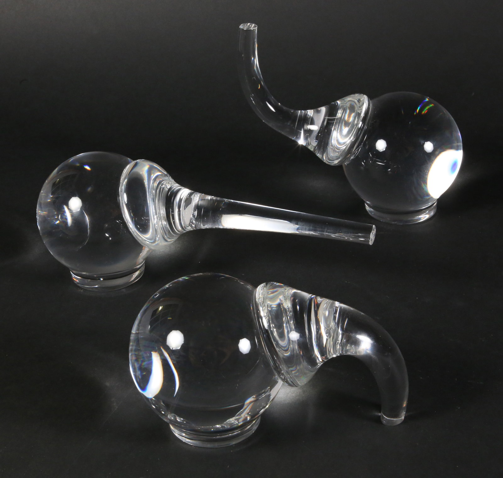 Group of Three Signed Steuben Clear Glass Elephants: Group of Three Signed Steuben Clear Glass Elephants Ranging from Height 4 in. Width 10 in. to Height 6 in. Width 7 in. Provenance: The Estate of Stephen Weinroth, Nantucket, Massachusetts