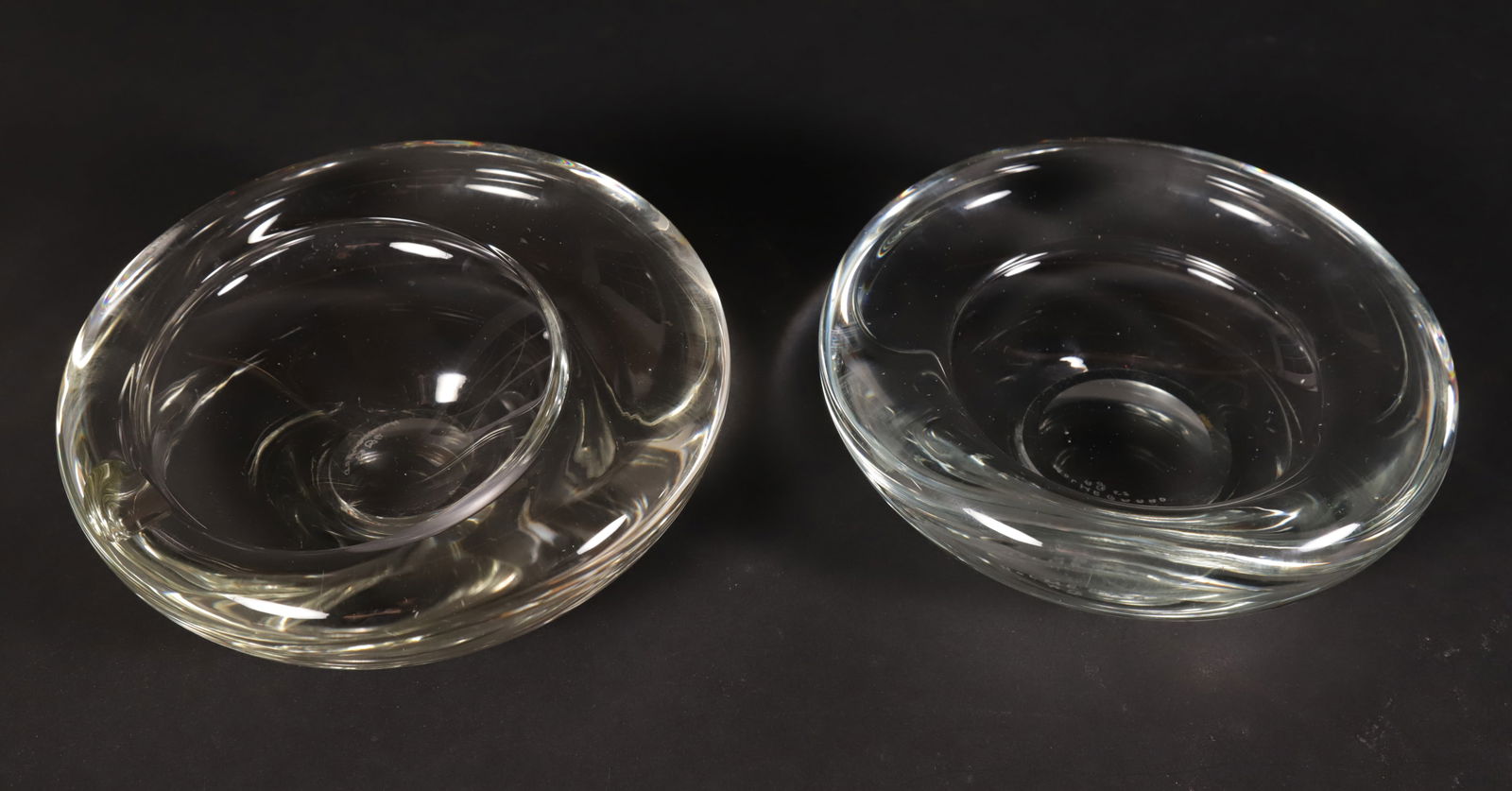 Two Signed Holmegaard Glass Ashtrays, circa 1957 and 1958: Two Signed Holmegaard Glass Ashtrays, signed and dated 1957 and 1958 Diameter 7.5 in.
