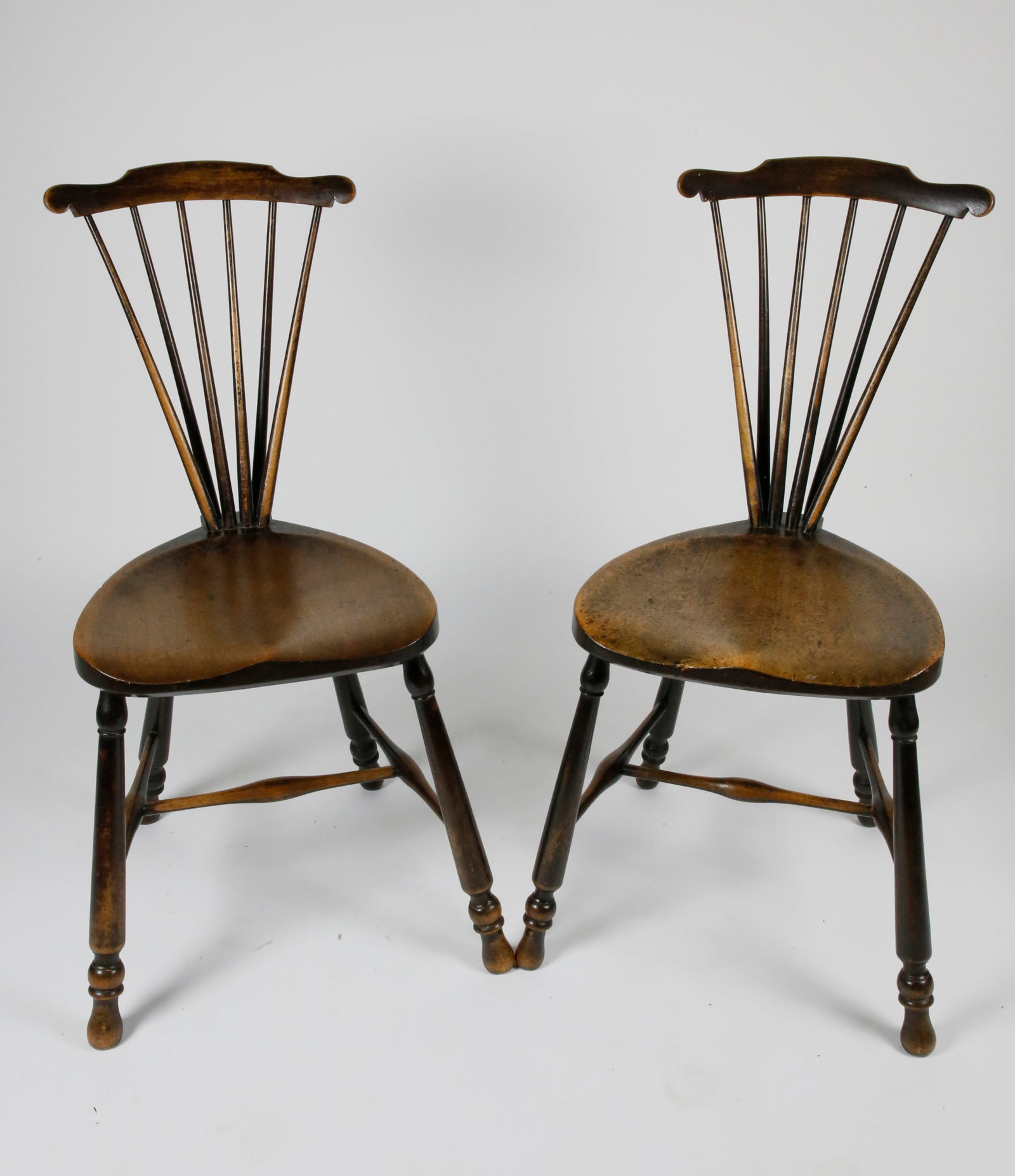Pair Of English Oak Brace Back Windsor Side Chairs: Pair Of English Oak Brace Back Windsor Side Chairs, with pear shaped plank seat and a carved crest rail Height 32 in.? Width 14 in.? Depth 16 in.