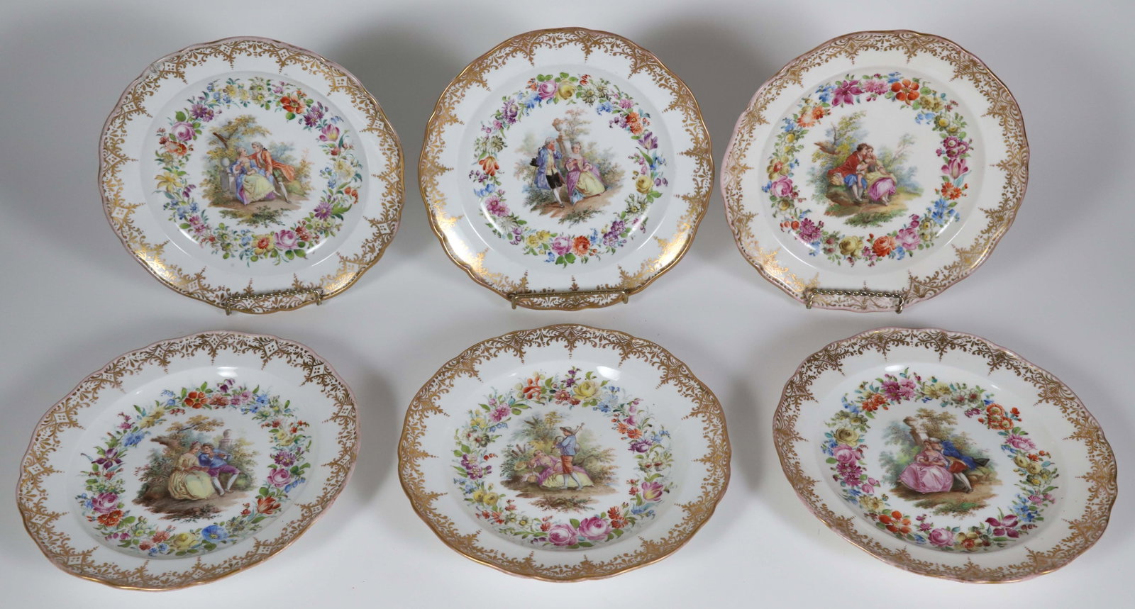 Set of Six Meissen Courtship Plates, 19th Century: Set of Six Meissen Courtship Plates, 19th Century, floral interior border surrounding each vignette and gilt outer border, cross swords mark on reverse Diameter 8.25 in.