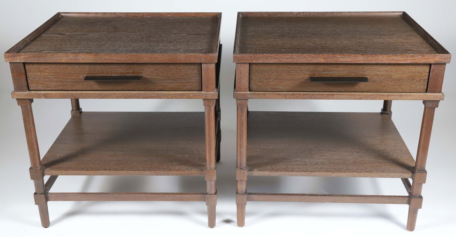Pair of Holly Hunt Oakwood Tables, 20th Century: Pair of Holly Hunt Oakwood Tables, 20th Century, made in America, single drawer above stretcher shelf, maker's label in drawer Height 26 in. Width 26 in. Depth 22 in.