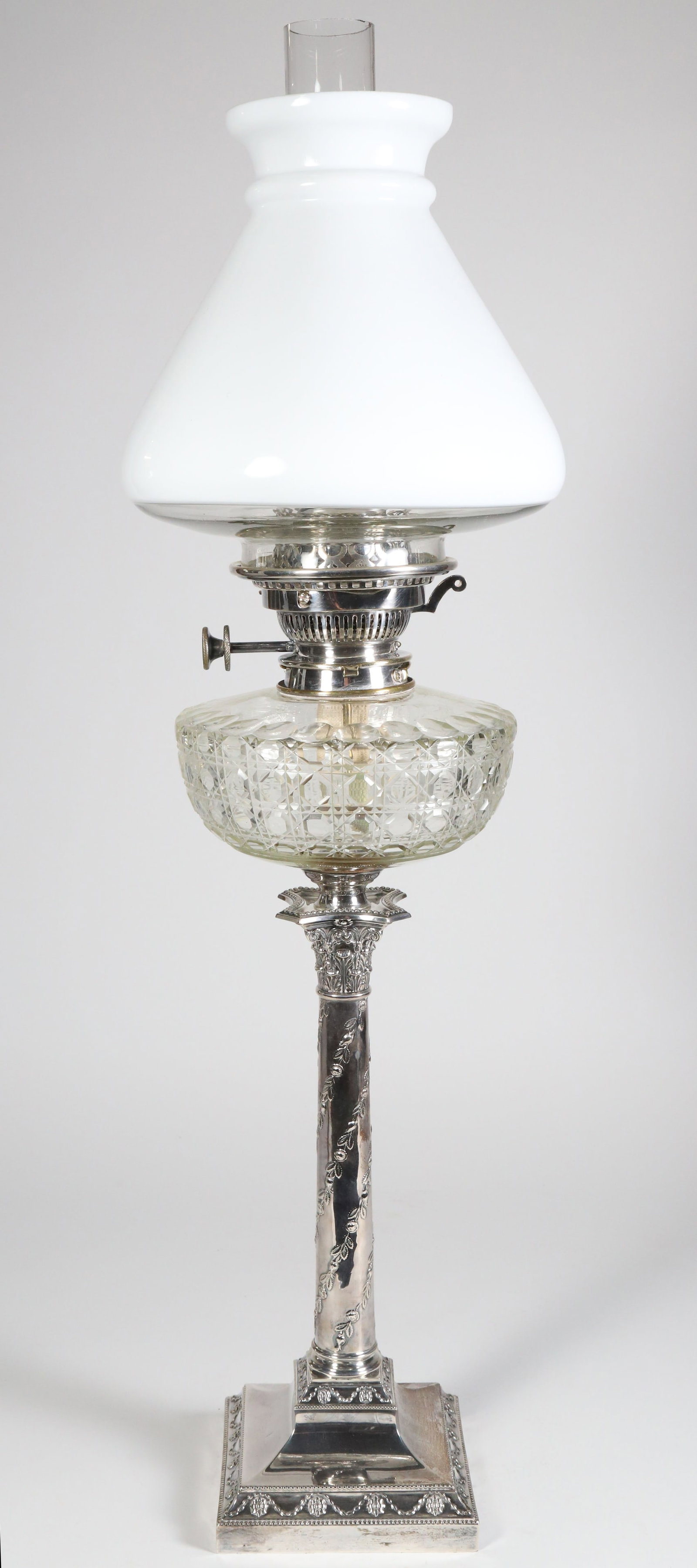 Edwardian Silver Column Lamp by Hawksworth, Eyre & Co., Sheffield 1908: Edwardian Silver Column Lamp by Hawksworth, Eyre & Co., Sheffield 1908, with cut glass font, milk glass shade, acid signed Trilux smoke chimney Height to Burner 20.5 in.