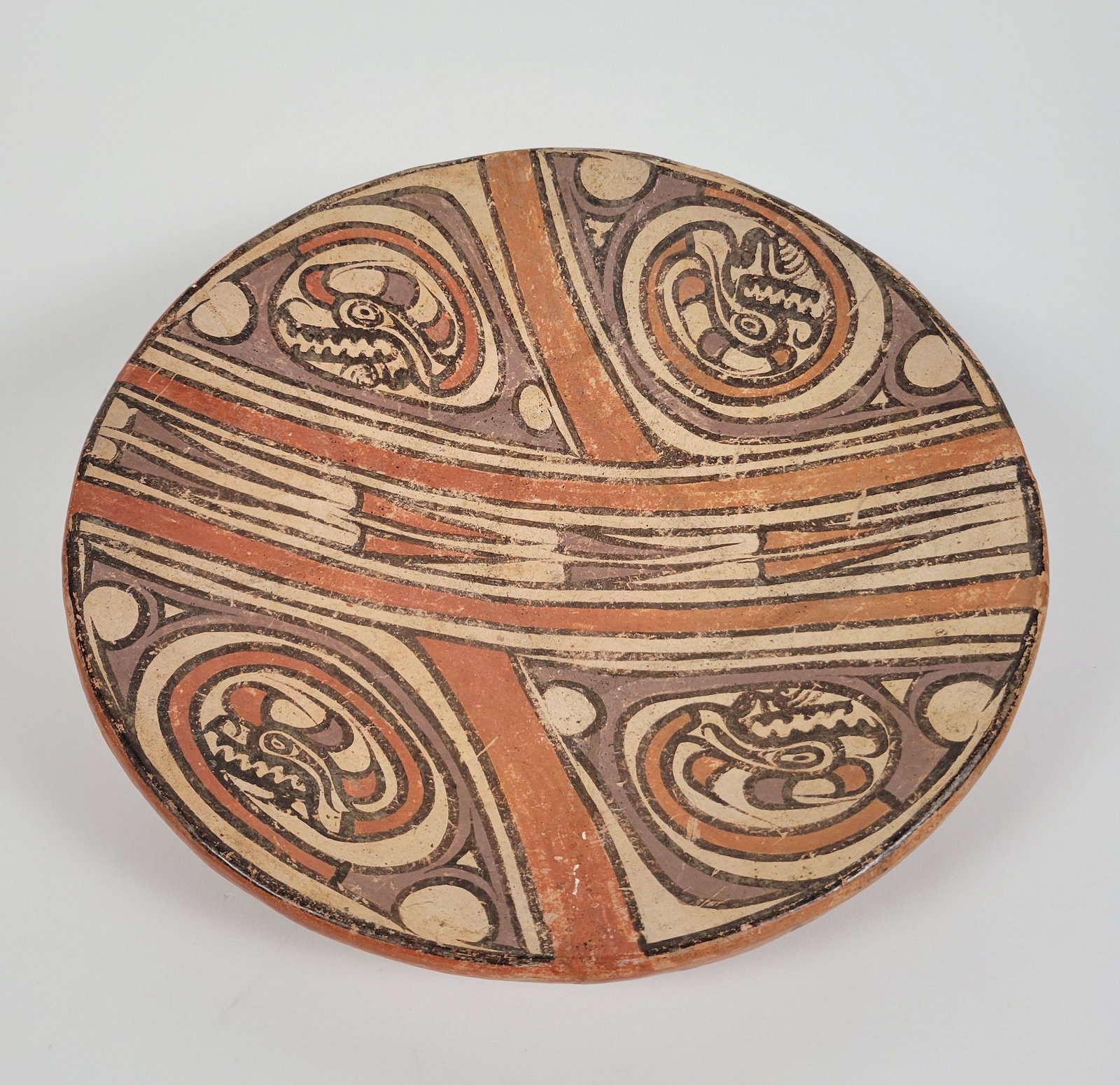 Panamanian Gran Cocle Pre-Columbian Decorated Dish Bowl: Panamanian Gran Cocle Pre-Columbian Decorated Dish Bowl, circa 1000-1400 CE, earthenware pottery decorated with stylized animal motifs, fully restored. Height 3.25 in. Diameter 13 in.