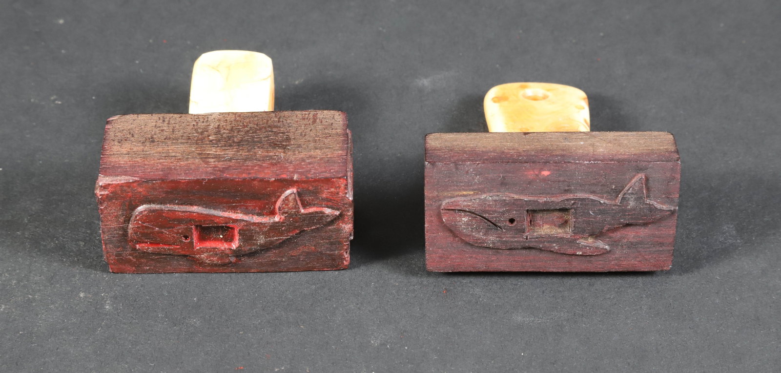 Two Whaleman Made Whale Stamps, 19th Century: Two Whaleman Made Whale Stamps, 19th Century, each with patinated antique ivory grip, the first carved on three sides, the second only with a full whale. Both with an open space to allow a barrel coun