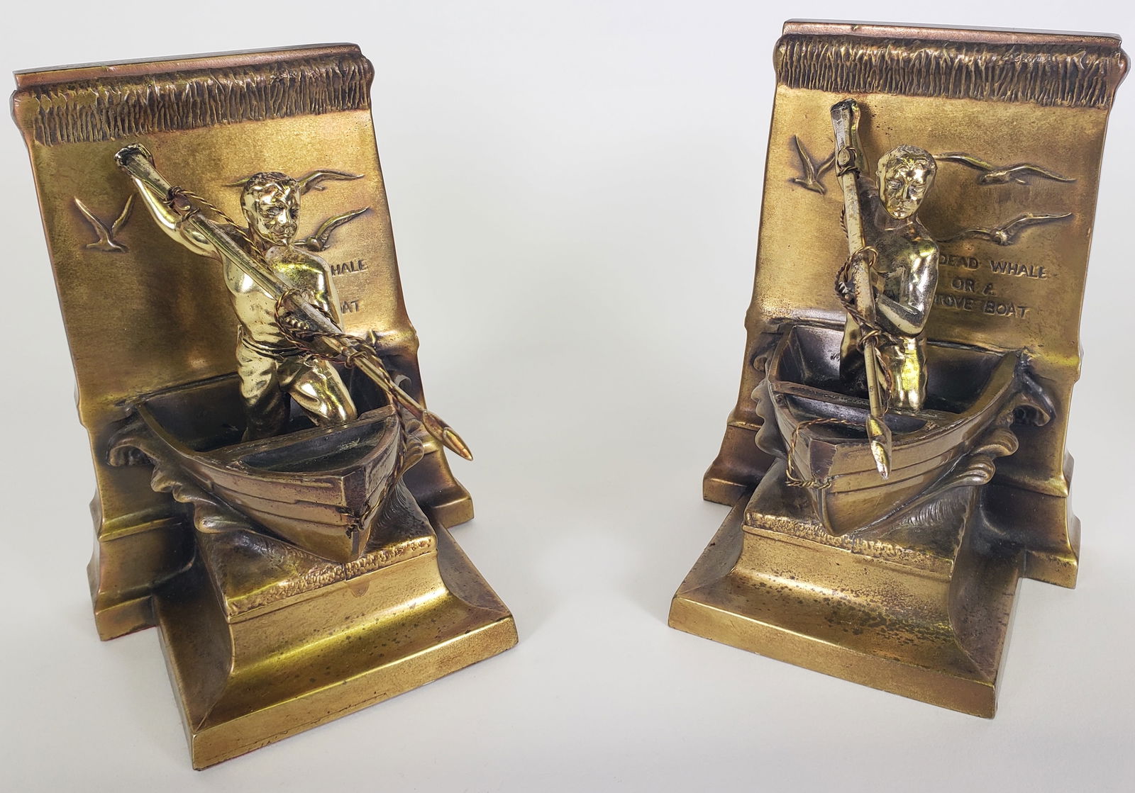 Pair of Vintage Brass New Bedford Moby Dick Whaler Bookends: Pair of Vintage Brass New Bedford Moby Dick Whaler Bookends, A Dead Whale or A Stove Boat, Philadelphia Manufacturing Company, 20th century. Height 6.75 in. Width 5 in. Depth 6 in.