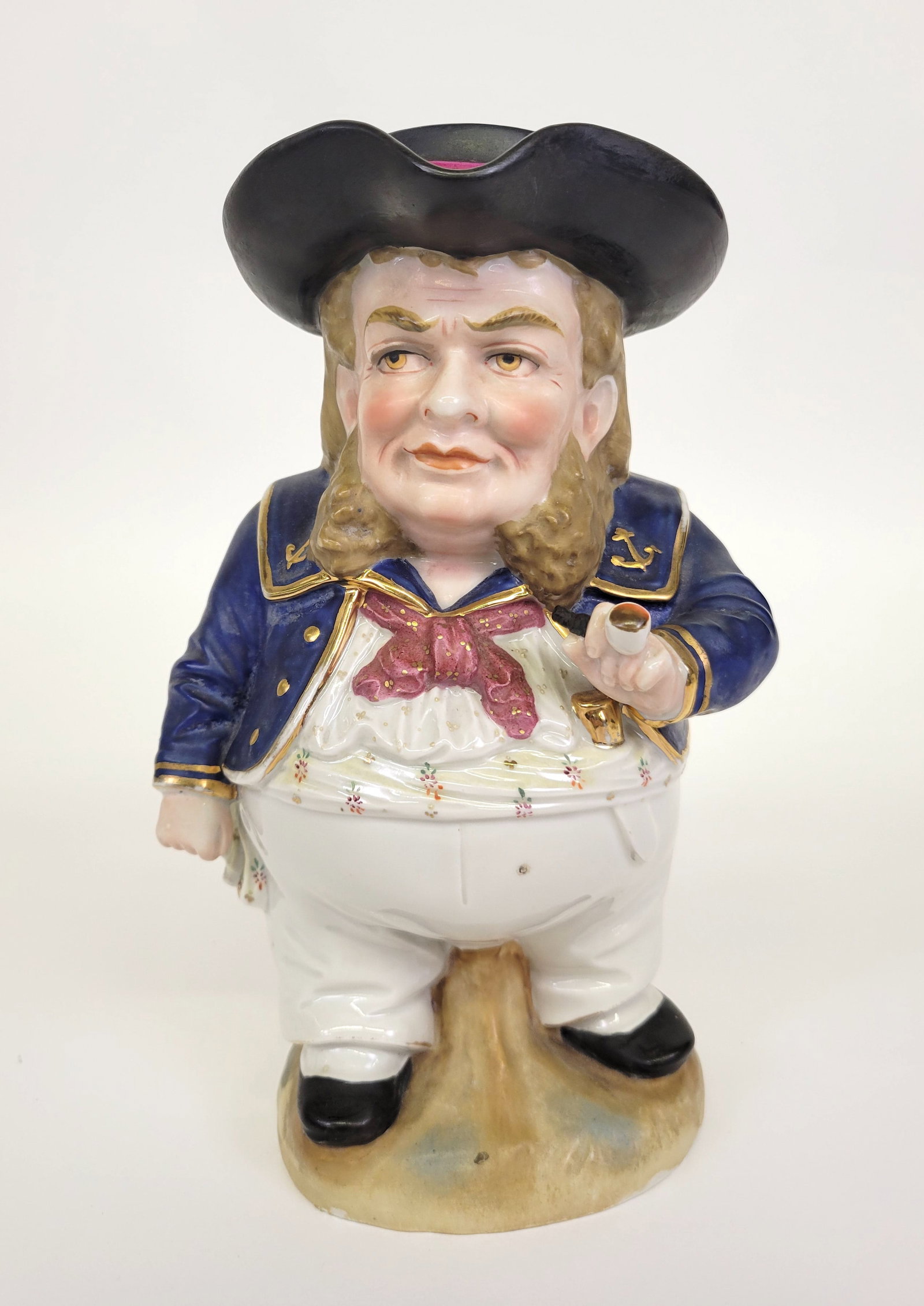 Fine 19th Century English Sailor Porcelain Toby Jug Pitcher: Fine 19th Century English Sailor Porcelain Toby Jug Pitcher, a jolly Jack Tar in uniform holding his pipe, lid of pitcher is the crown of his hat, with script D Derby Pottery hallmark on underside. He