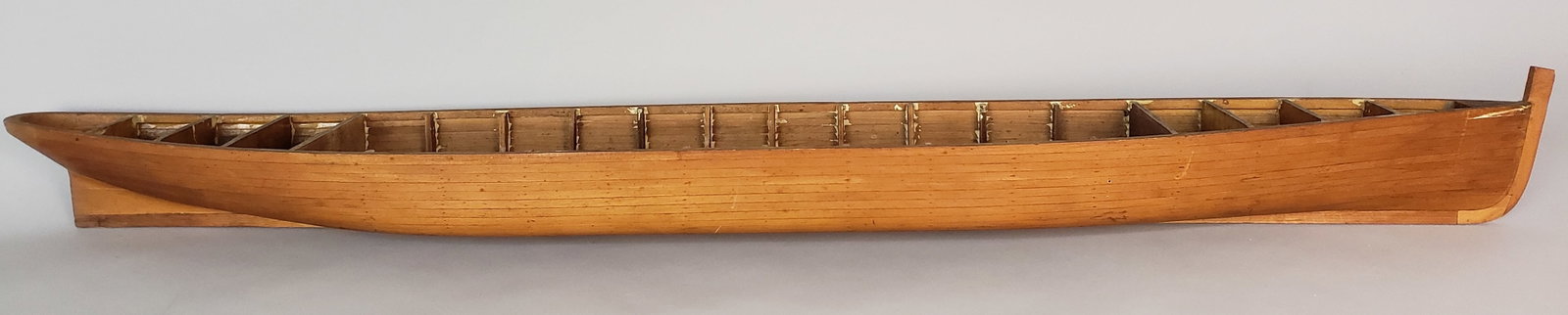 Fine Antique - Vintage Model of an Adirondack Guideboat: Fine Antique - Vintage Model of an Adirondack Guideboat, lapstrake construction and hand carved keel Length 40.75 in. Width 6.25 in. Height 4 in.