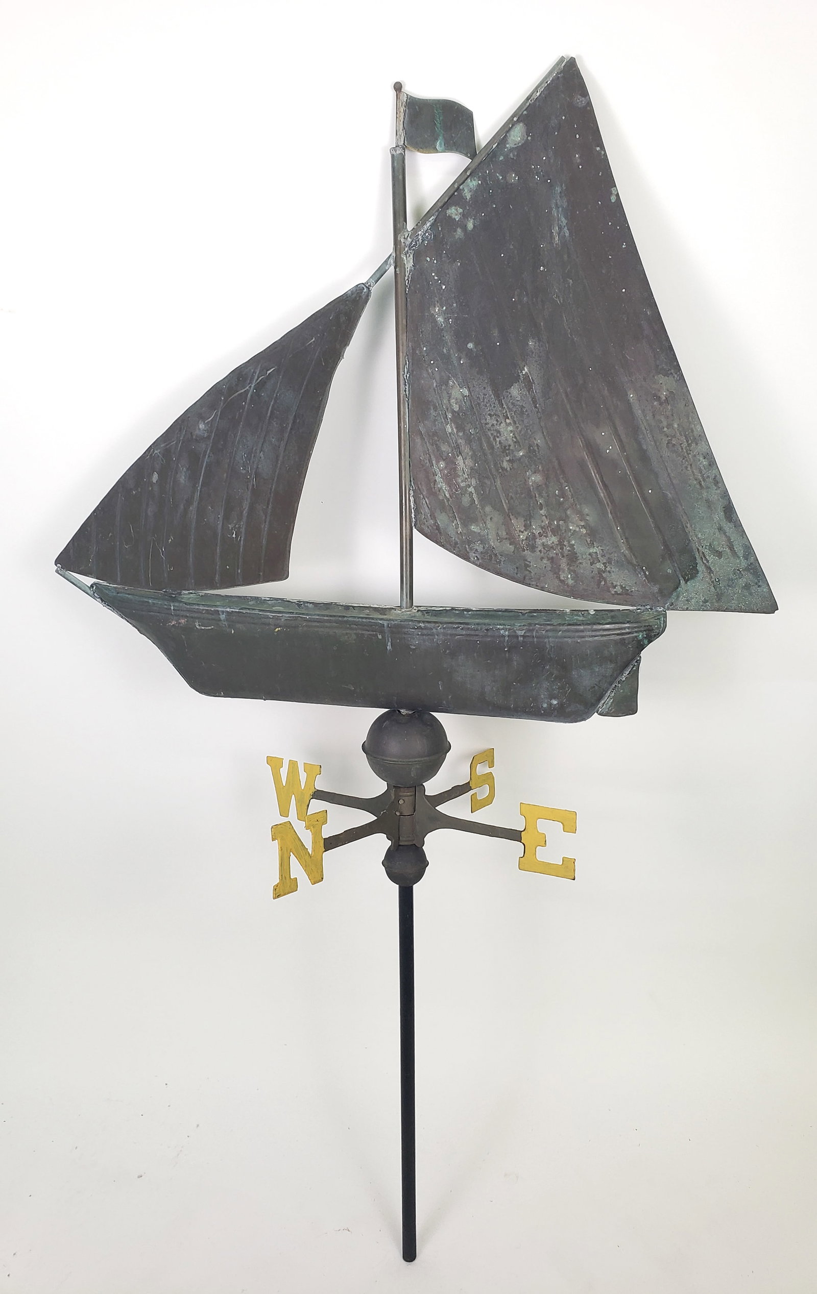 Antique Copper Sailboat Weathervane, early 20th Century: Antique Copper Sailboat Weathervane, early 20th Century, with most unusual adjustable flag at the top of the mast. Boat Height 28 in. Width 34 in.