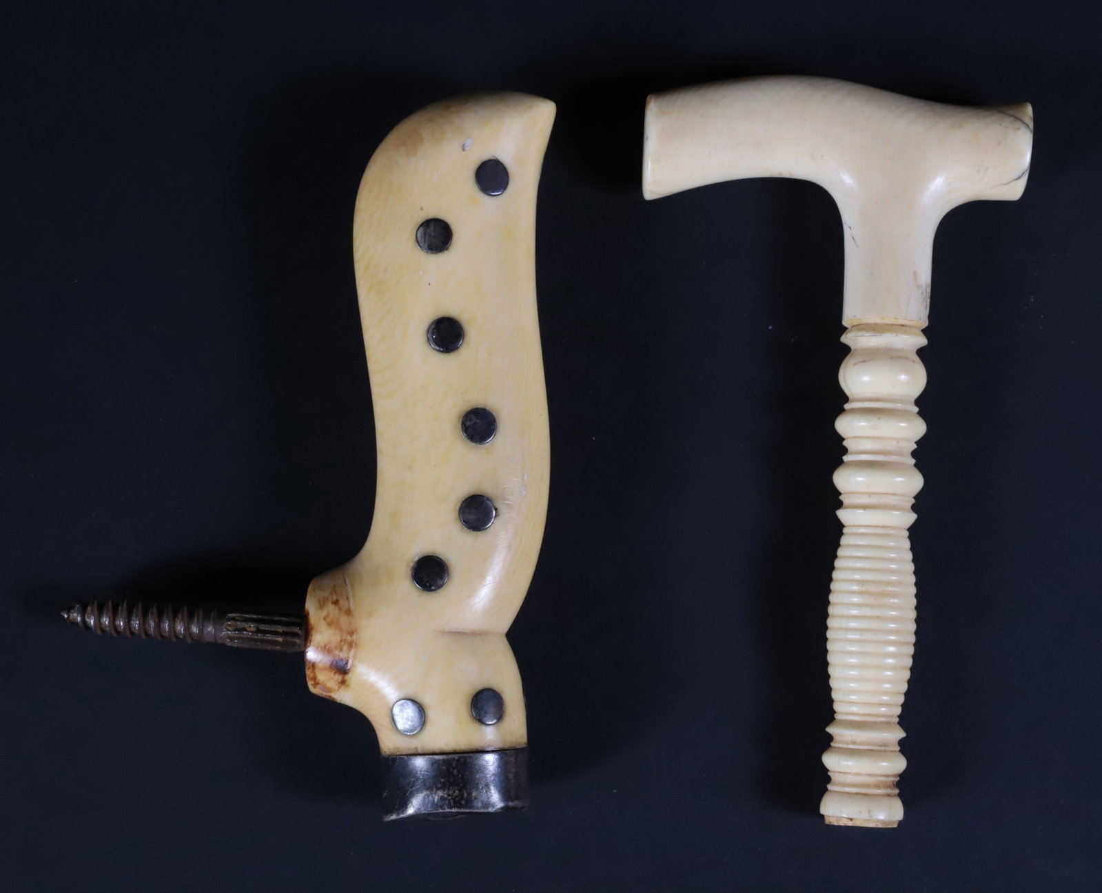 Two Whaleman Made Antique Whale Ivory Carved Cane Tops, 19th Century: Two Whaleman Made Antique Whale Ivory Carved Cane Tops, 19th Century, inlaid with abalone and silver dots Length 4.5 in.