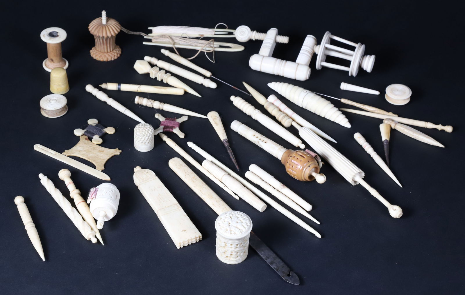 Collection of Forty-two Lady's Sewing Utensils, 19th Century: Collection of Lady's Sewing Utensils, 19th Century, approximately 42 pieces including an assortment of bodkins, needle cases, thimbles, bobbins, and thread stars, crochet hooks, mostly fashioned of bo