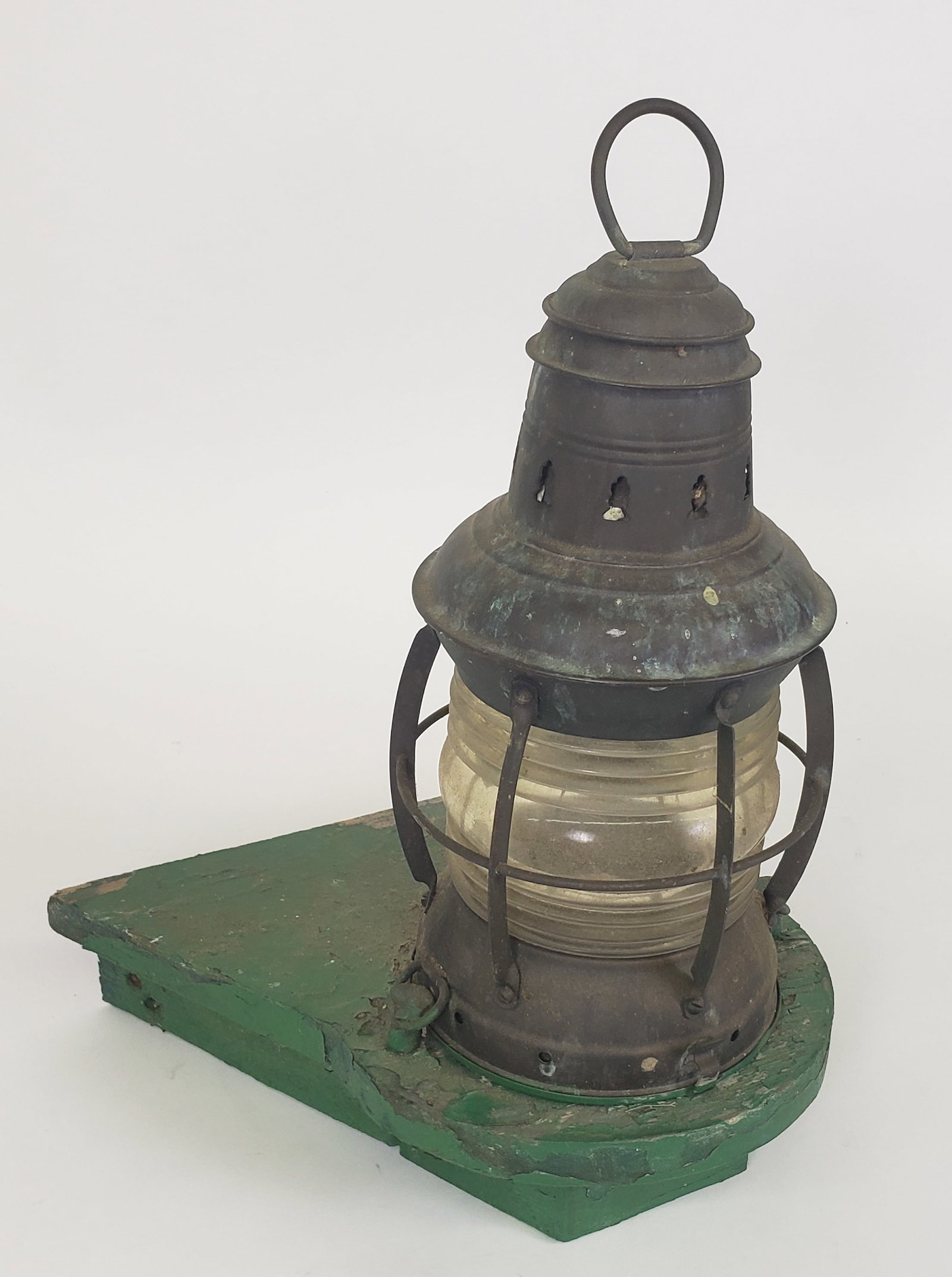 Antique Starboard Light Ships Lantern: Antique Starboard Light Ships Lantern, with original green painted running board from the ship. Height 16 in. Width 13.5 in. Depth 9.5 in.