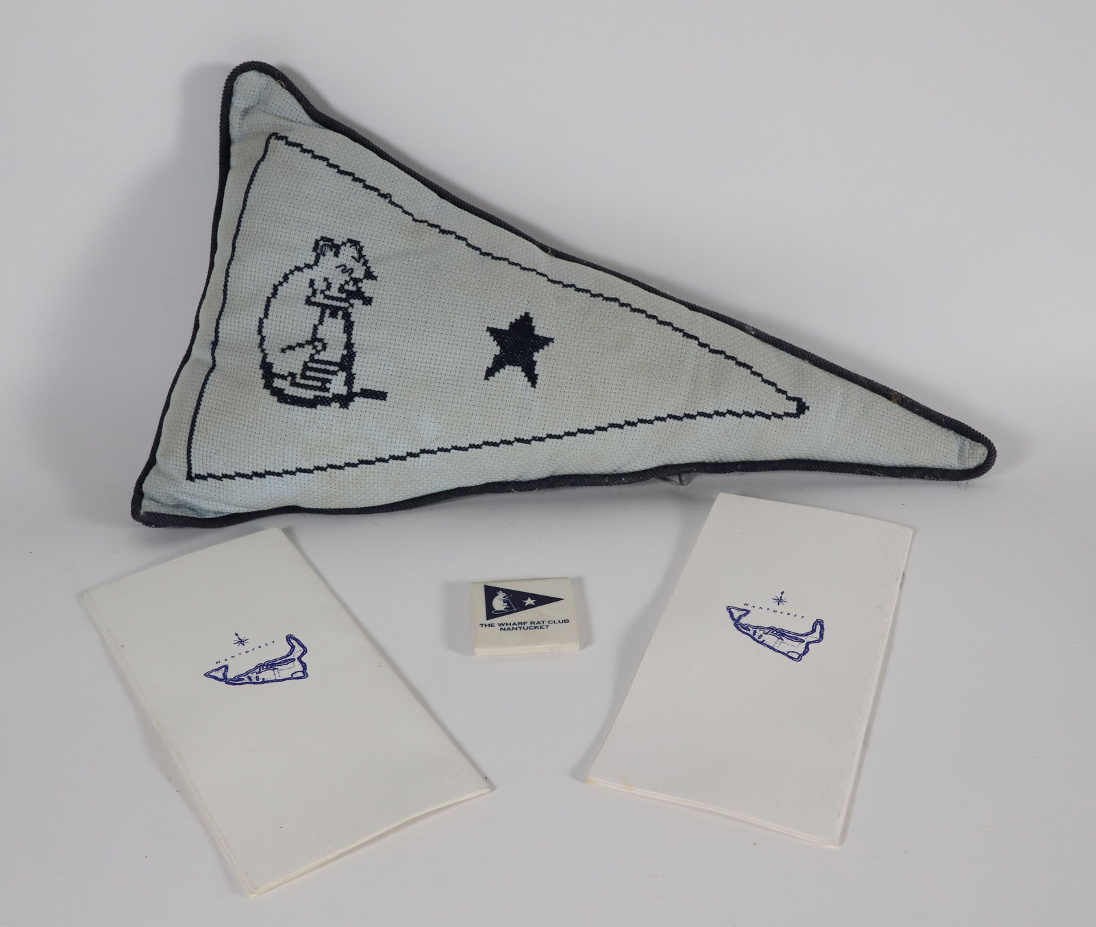 Nantucket Wharf Rat Club Burgee Needlepoint Pillow with 1987 and 1990 Membership Rosters: Nantucket Wharf Rat Club Burgee Needlepoint Pillow with 1987 and 1990 membership rosters and tile Pillow 10.5 in. x 18 in. Provenance: The Estate of Anne Gardner DiVenere, Nantucket Island, Massachuse