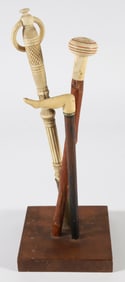 Collection of Two Carved Walking Stick Handles and One Parasol Handle, 19th Century