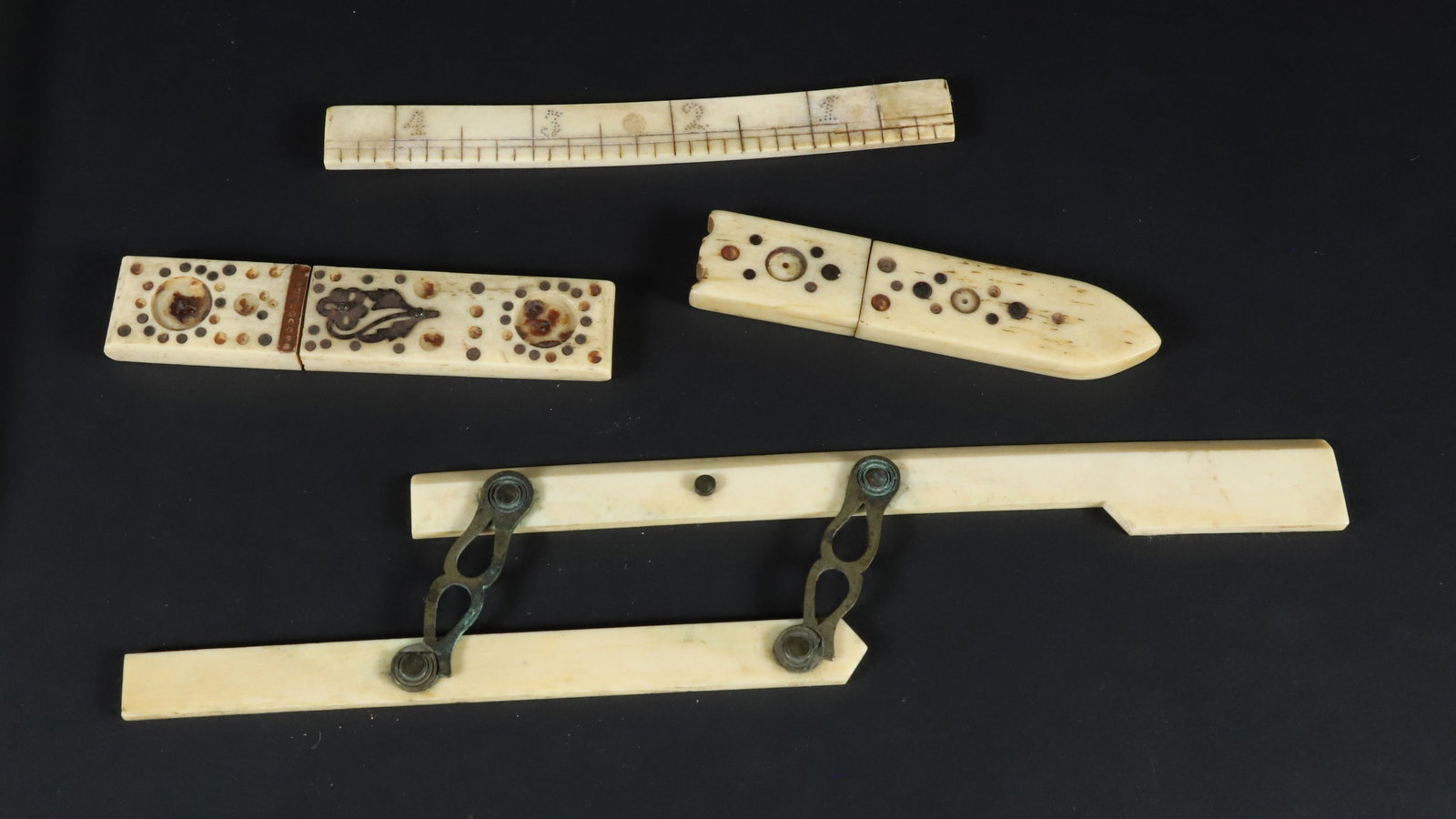 Collection of Four Whaleman Made Whalebone and Antique Whale Ivory Artifacts, 19th Century: Collection of Four Whaleman Made Whalebone and Antique Whale Ivory Artifacts comprising: Two inlaid Needle Cases 4 in. Ruler Parallel Ruler Provenance: Estate of Anne Gardner DiVene