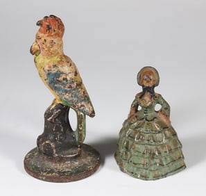 Two Antique Polychrome Cast Iron Doorstops, a Parrot and a Lady
