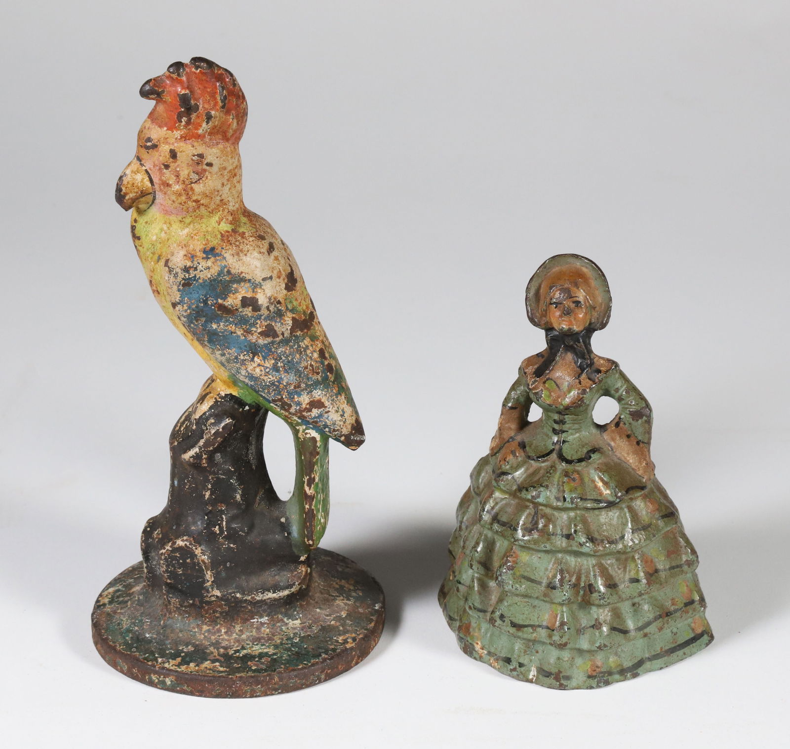Two Antique Polychrome Cast Iron Doorstops, a Parrot and a Lady: Two Antique Polychrome Cast Iron Doorstops, a Parrot and a Lady Height 7.5 in.