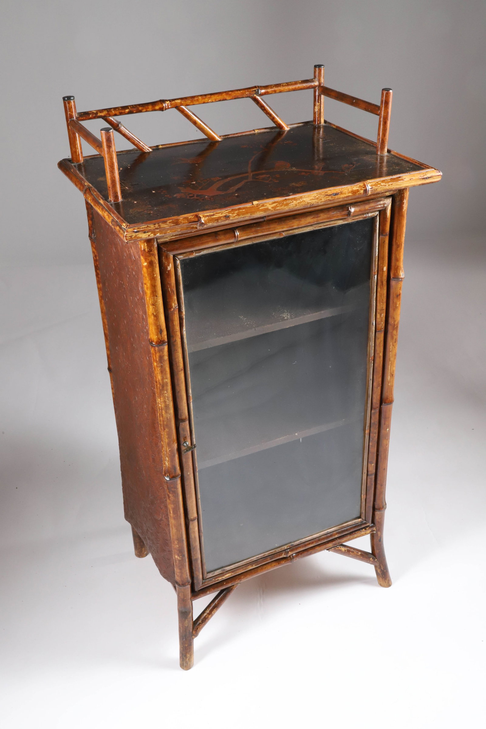 Antique Lacquered Bamboo Bookcase: Antique Lacquered Bamboo Bookcase, with glass door Height 41 in. Width 20 in. Depth 15 in.