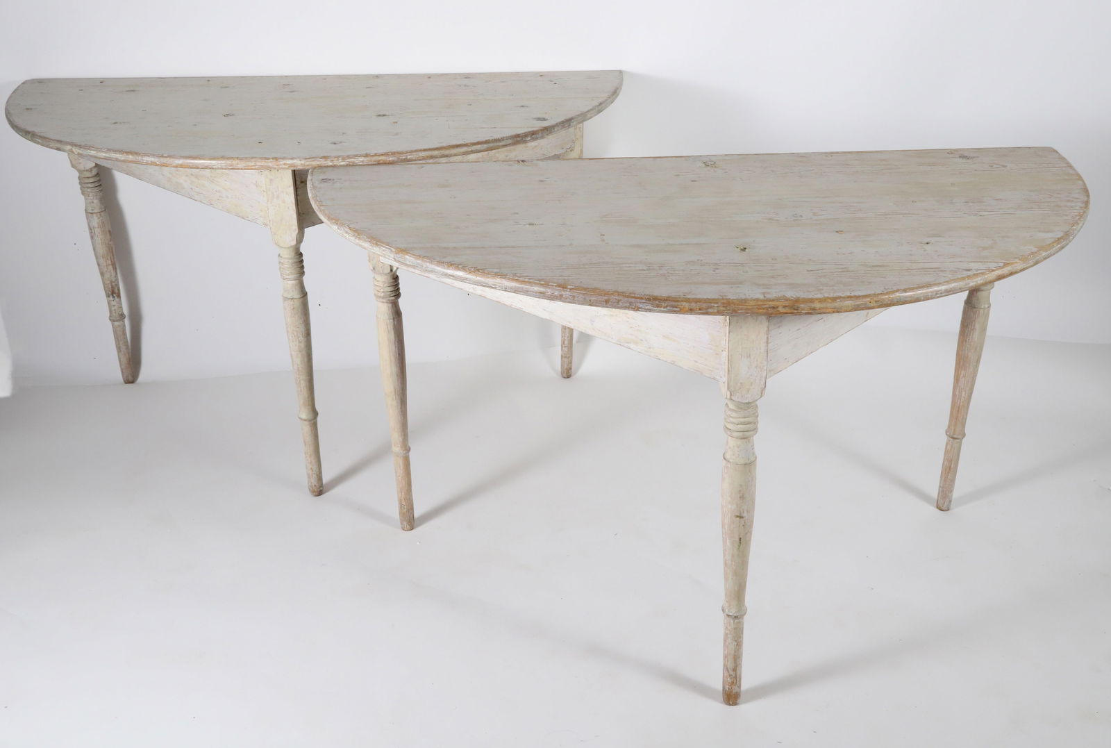 Pair of Gustavian White Washed Half-Round Console Tables, 19th Century: Pair of Gustavian White Washed Half-Round Console Tables, 19th Century, on turned tapering legs Height 29 in. Width 50 in. Depth 25 in.