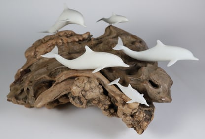 Pod of Five White Ceramic Dolphins Atop a Wave of Driftwood