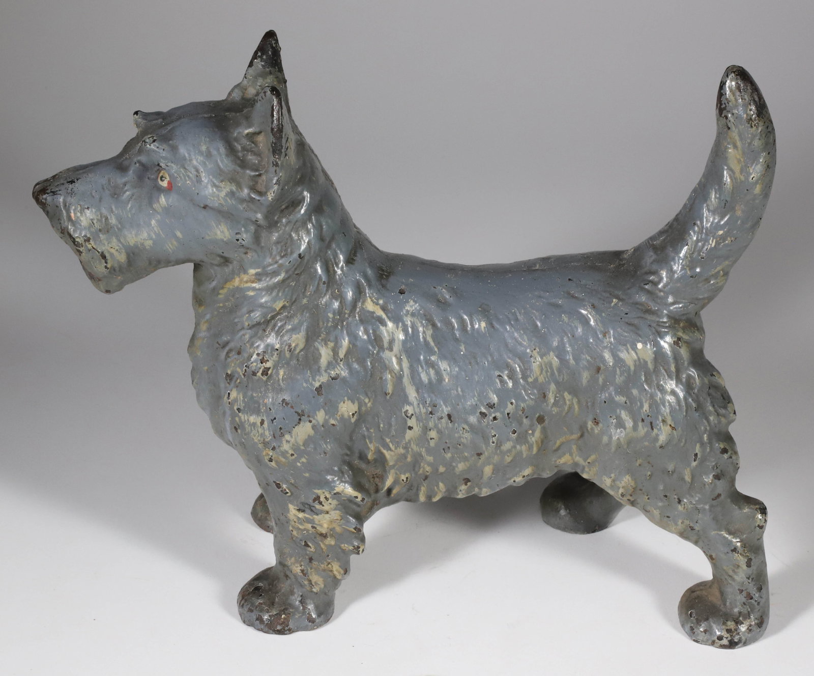 Antique Cast Iron Scottish Terrier Doorstop by Hubley, circa 1910: Antique Cast Iron Scottish Terrier Doorstop by Hubley, circa 1910, in scarce original grey paint Height 8.5 in. Length 11 in. Width 4 in.