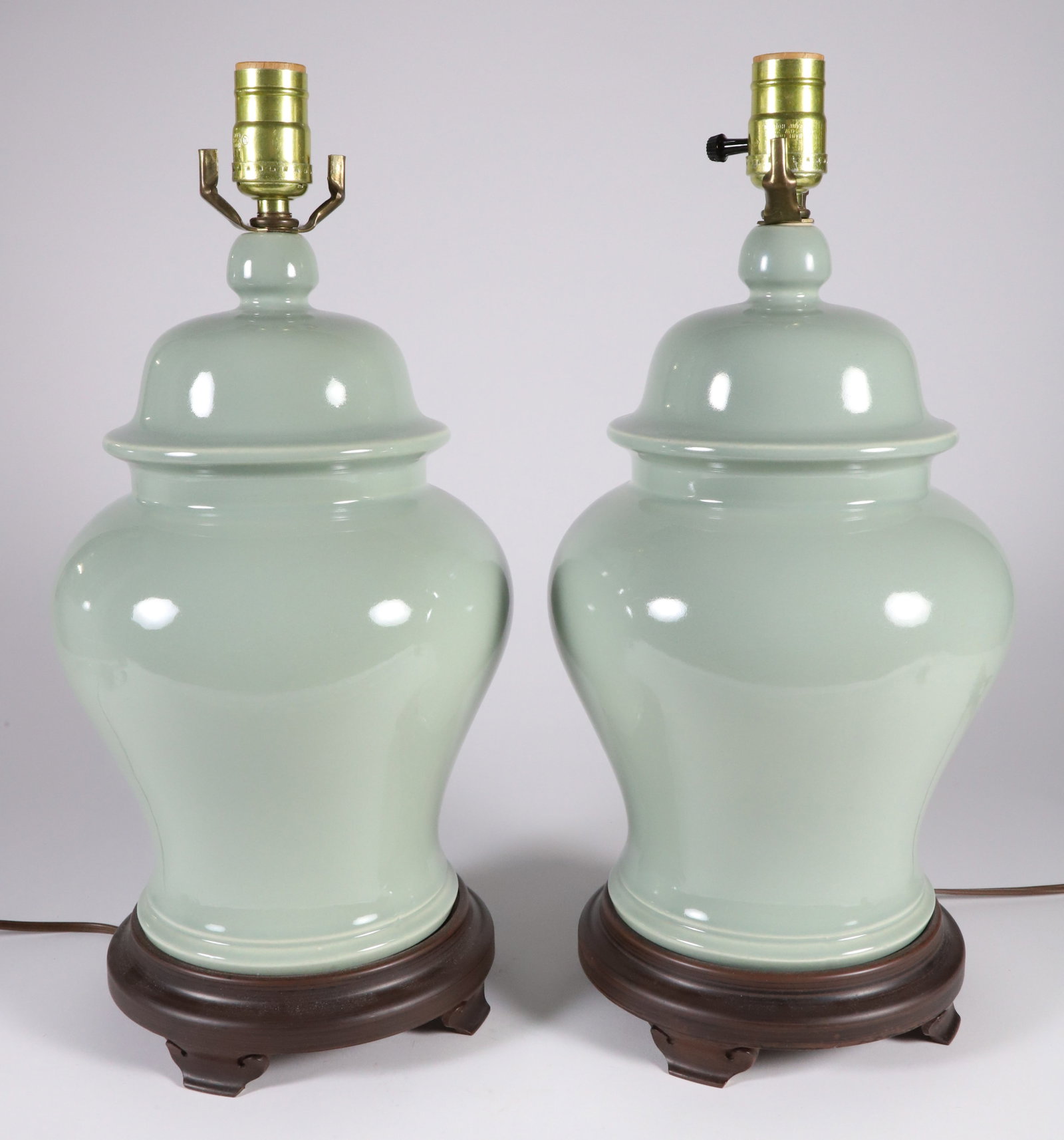 Pair of Contemporary Celedon Green Glazed Temple Jars Mounted as Lamps: Pair of Contemporary Celedon Green Glazed Temple Jars Mounted as Lamps Height 12 in. Provenance: Collection of Susan Akers, 7 Pleasant Street, Nantucket Island, Massachusetts