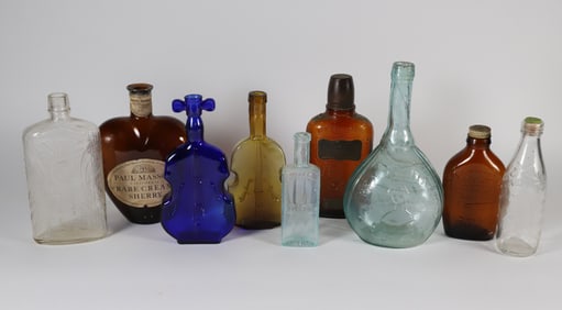 Nine Antique Bottles in Various Forms and Colors