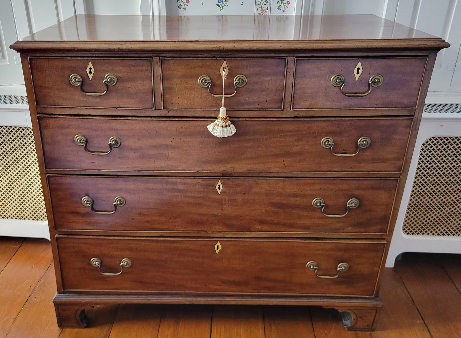 Georgian Mahogany Chest of Six Drawers, early 19th Century: Georgian Mahogany Chest of Six Drawers, early 19th Century, three over three drawers, diamond shaped bone escutcheons, brass post and bail hardware, on petite bracket feet Height 38 in. Width 44 in. D