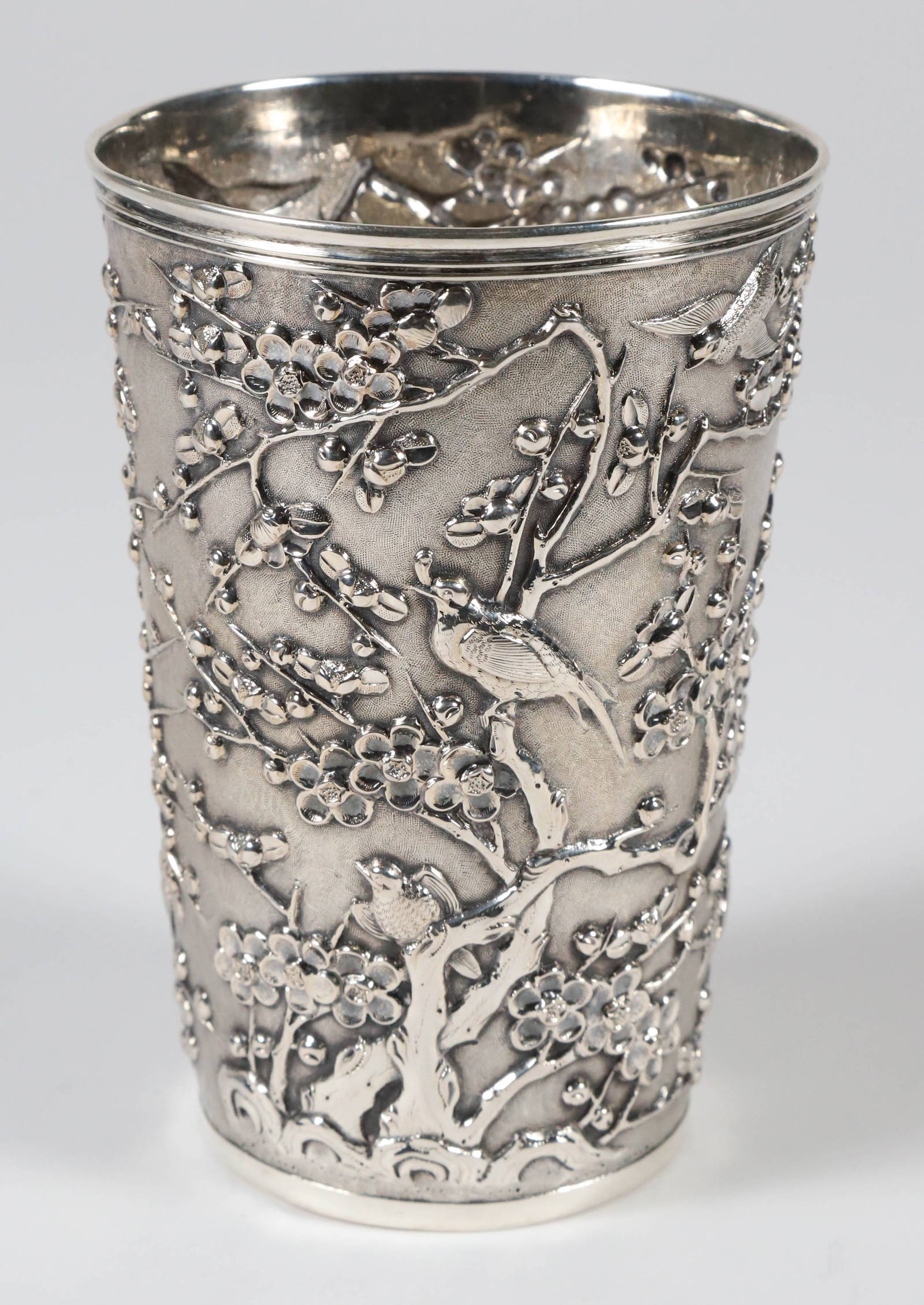 Chinese Export Silver Beaker with Repousse Prunus Blossoms and Birds, Signed Luen Wo