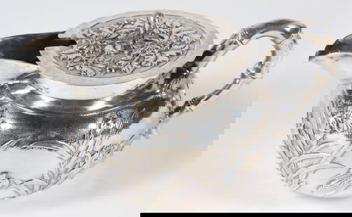 Chinese Export Silver Covered Creamer, Stamped Shanghai: Chinese Export Silver Covered Creamer Stamped Shanghai, with bamboo handle and embossed water lilies and egrets Length 6 in. 7.2 Troy Ounces Provenance: Collection of Susan Akers, 7 Pleasant Street, N