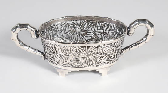 Chinese Export Silver Reticulated Two Handled Oval Bowl, late 19th Century / early 20th C.: Chinese Export Silver Reticulated Two Handled Oval Bowl, late 19th Century / early 20th C, pierced bamboo leaves and handles design, signed underneath. 2.5 Troy Ounces Height 2 in. Length 6 in. Depth