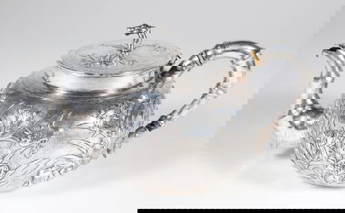 Chinese Export Silver Teapot Embossed with Lilies and Waterfowl, Stamped Shanghai: Chinese Export Silver Teapot Embossed with Lilies and Waterfowl, Stamped Shanghai, bamboo form handle and spout, the body embossed lilies and waterfowl 17.6 Troy ounces Height 4.5 in. Length 9 in. Pro