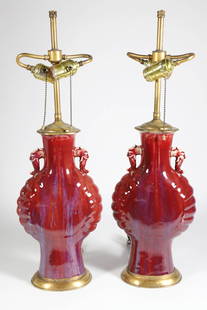 Pair of Chinese Oxblood Flambe Glazed San de Boeuf Vases Mounted as Lamps, 19th Century: Pair of Chinese Oxblood Flambe Glazed San de Boeuf Vases Mounted as Lamps, 19th Century, flat vases with applied animal head handles, brass engraved mountings Vase Height 14 in.
