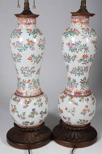Pair of Chinese Export Famille Rose Porcelain Lamps, 19th Century: Pair of Chinese Export Famille Rose Porcelain Vases Mounted as Lamp, 19th Century, carved teak bases and pagoda caps Height 17 in. Provenance: The Estate of Carolyn Wells, Nantucket Island, Massachuse