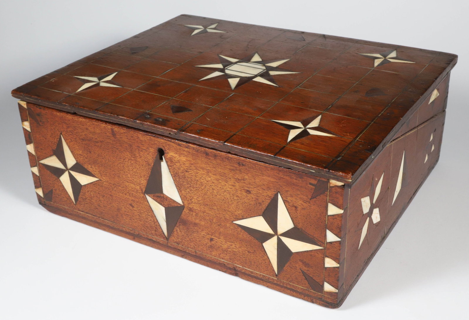 Mariner's Tropical Woods Inlaid Box, circa 1870: Mariner's Tropical Woods Inlaid Box, circa 1870, with tropical woods and antique whale ivory inlaid stars, geometric designs and dovetailing, the lid opes to reveal a print depicting six sea Captains