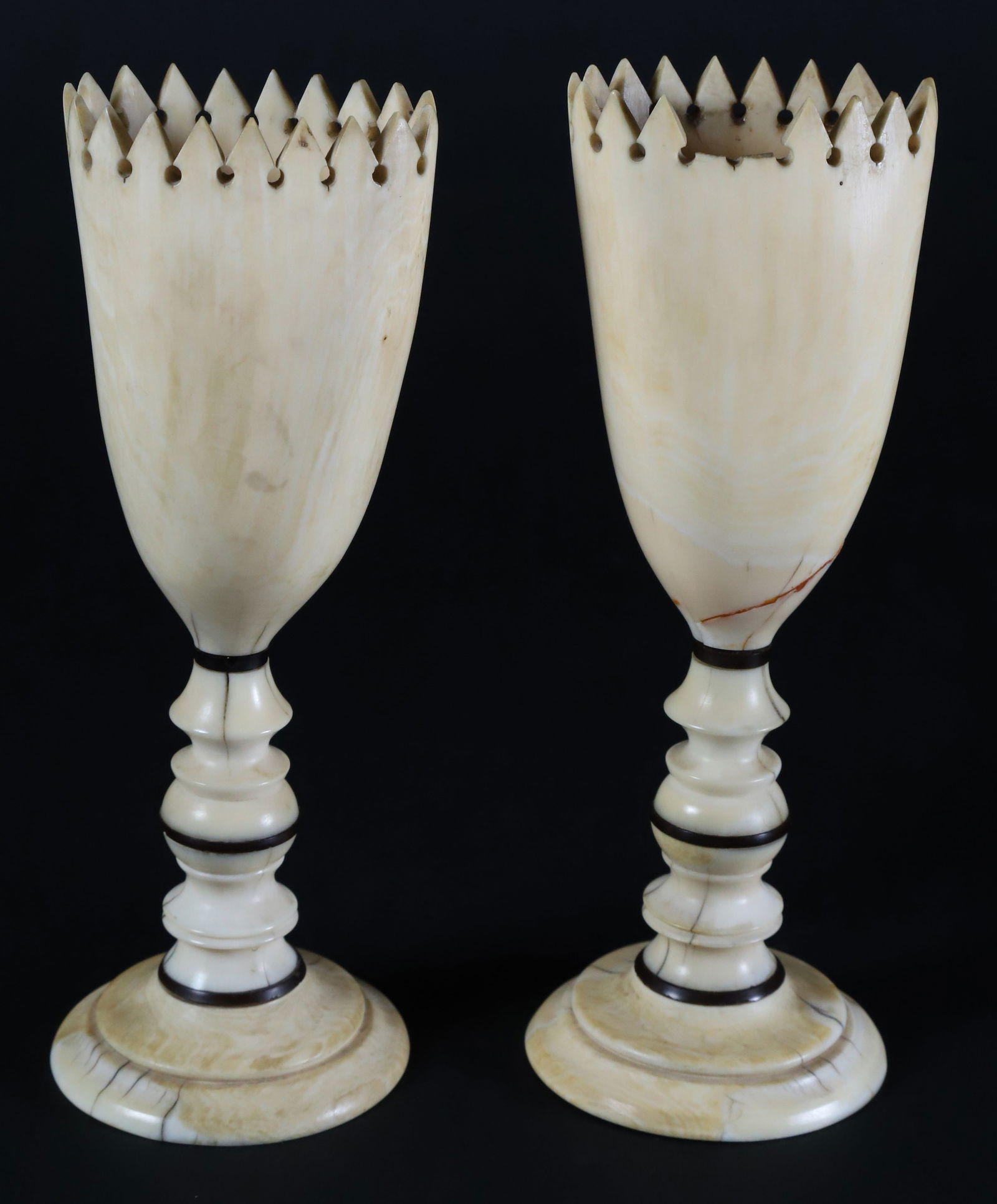 Pair of Whaleman Made Vases, 19th century: Pair of Whaleman Made Vases, 19th century, fashioned from antique sperm whale teeth, inverted and carved with dot and dagger edge, on turned standards with baleen spacers, on round step-down vases, no