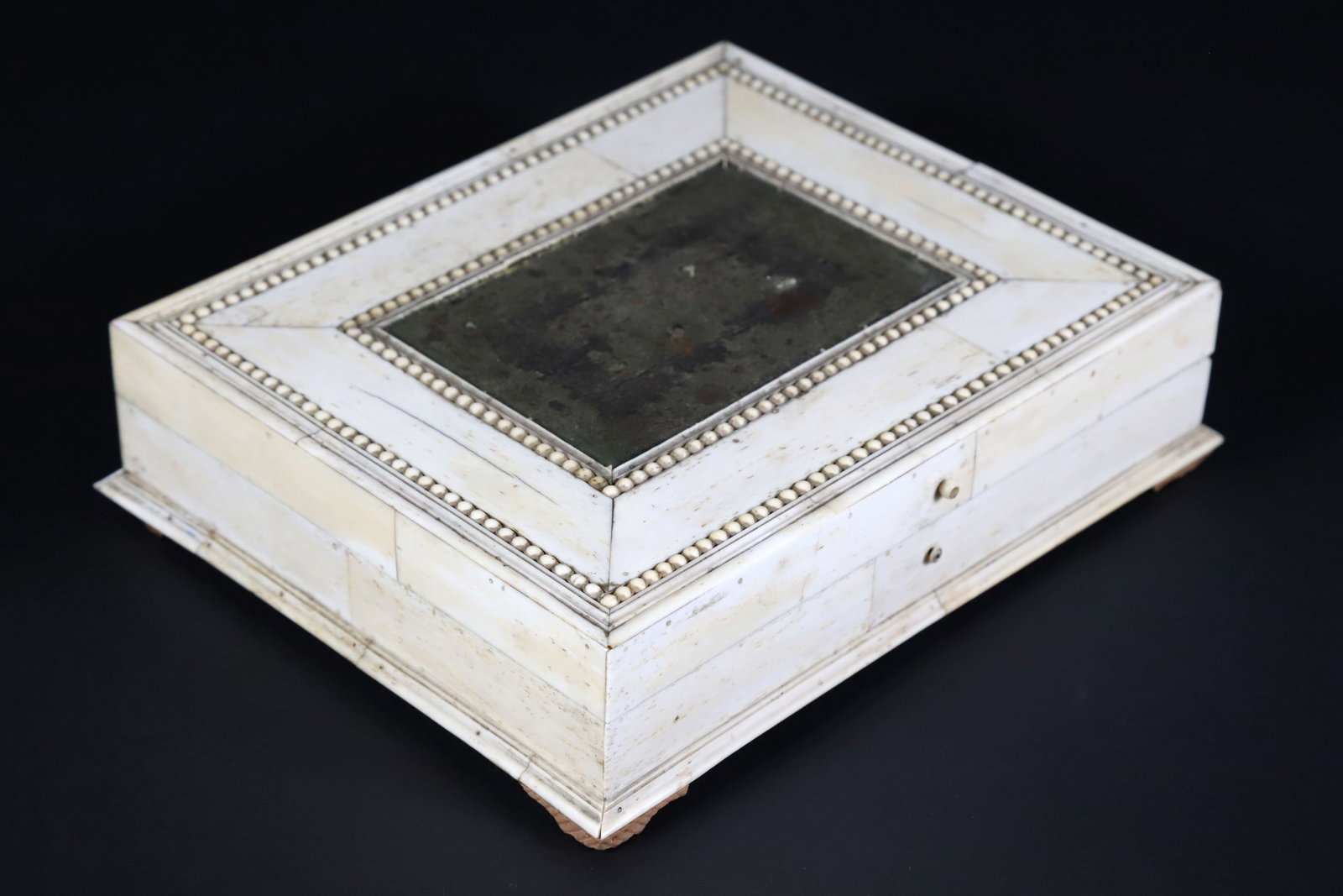 French Bone Game Box, 19th Century: French Bone Game Box, 19th Century, trimmed with carved bead accents, the interior fitted with four bone trays and fabric lined Height 2 in. Length 8.5 in. Width 7 in.