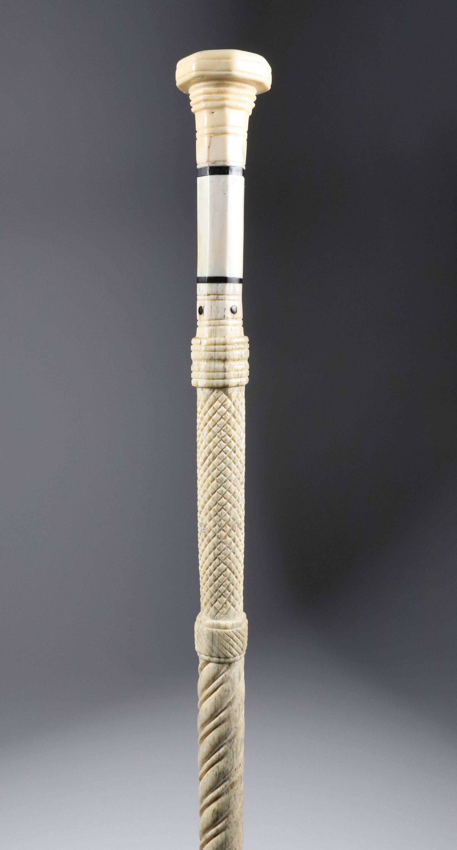 Whaler Made Octagonal Grip Walking Stick, mid 19th Century: Whaler Made Octagonal Grip Walking Stick, mid 19th Century, antique whale ivory octagonal grip with two baleen spacers above a carved whale bone shaft with diamond, wormed rope and twist carved shaft