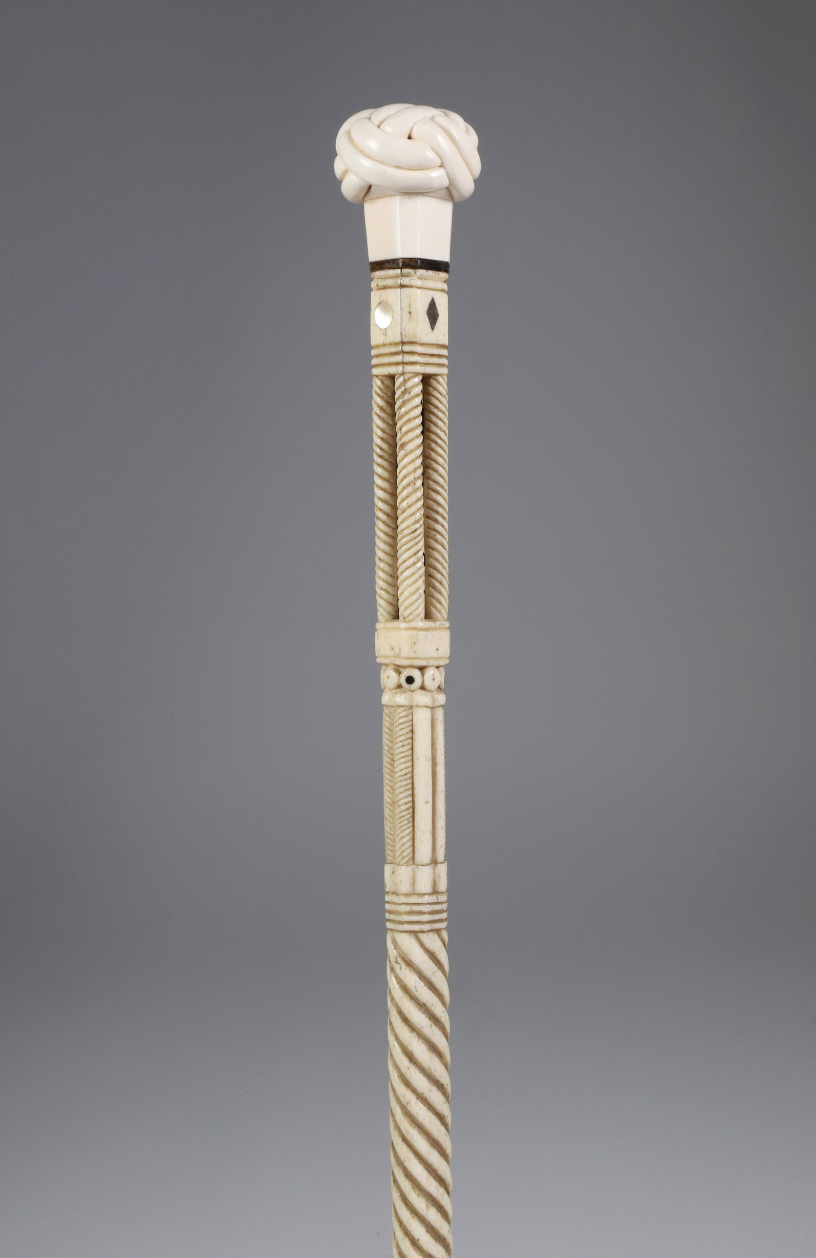 Whaler Made Turk's Head Knob Grip Architectural Walking Stick, mid 19th Century: Whaler Made Turk's Head Knob Grip Architectural Walking Stick, mid 19th Century, antique whale ivory turk's head grip on a carved whale bone shaft with architectural open columns, the interior with ba