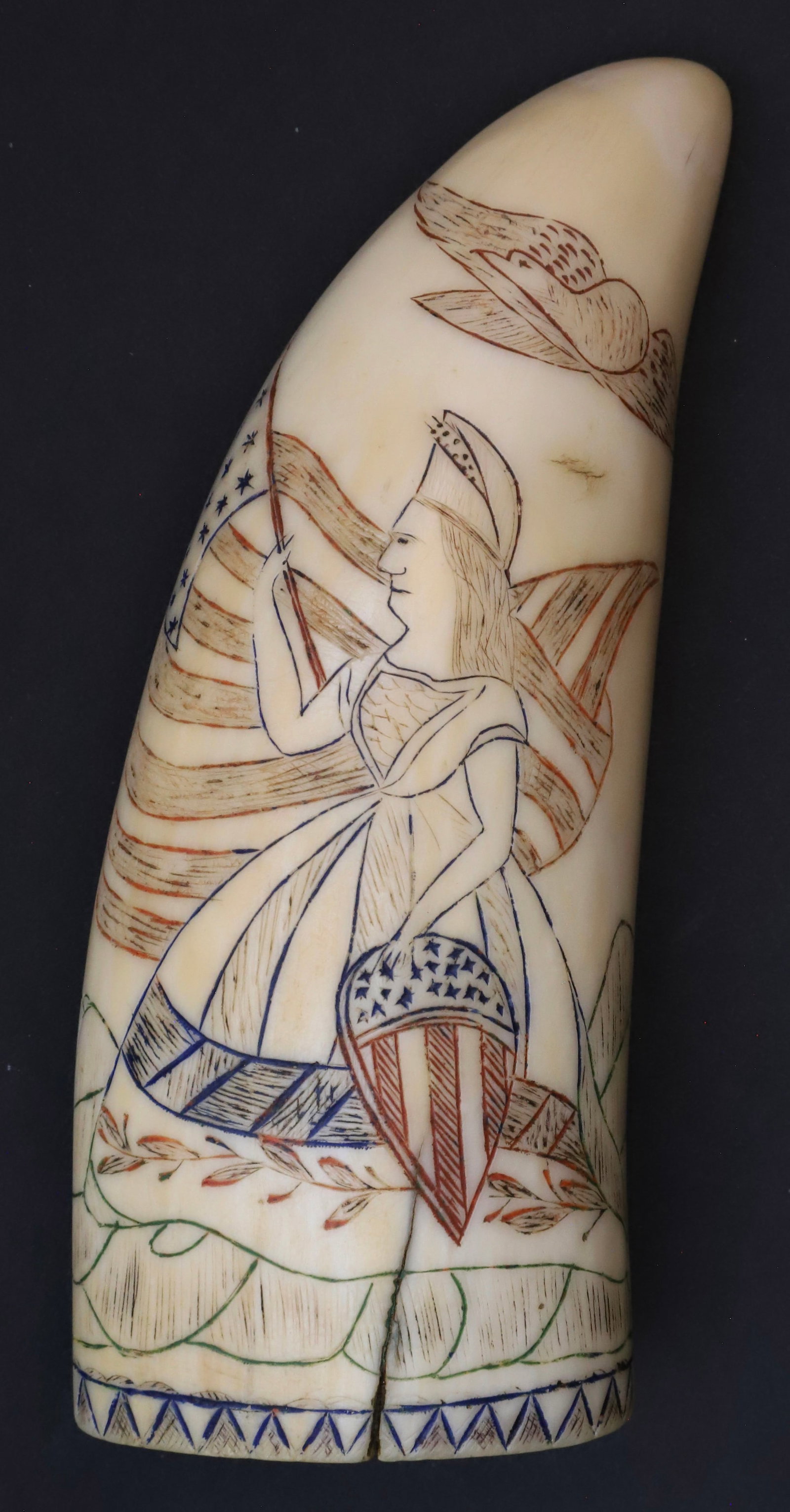 Polychromed Scrimshaw Whale Tooth "Frigate St. Lawarence 1861", 19th Century: Polychromed Scrimshaw Whale Tooth "Frigate St. Lawarence 1861", 19th Century, engraved on both sides in red, green and blue, Lady Liberty on a rock formation with Federal shield, 19 star flag and eagl