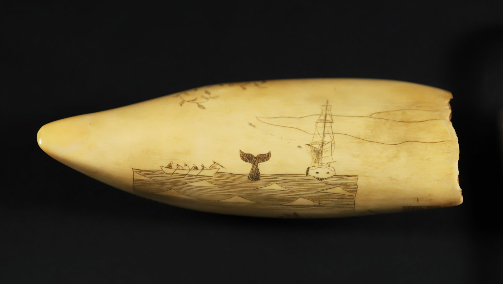 Scrimshaw Antique Polychrome Whale Tooth "Three Brothers": Scrimshaw Antique Polychrome Whale Tooth "Three Brothers", engraved with the whale ship Three Brothers and Arctic whaling scene Length 6.5 in. Width 2.75 in.