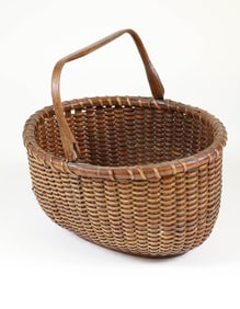 Antique Oval Swing Handle Nantucket Basket In Old Dark Surface