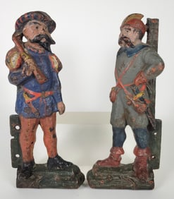 Two Antique Paint Decorated Cast Iron Soldier Architectural Brackets