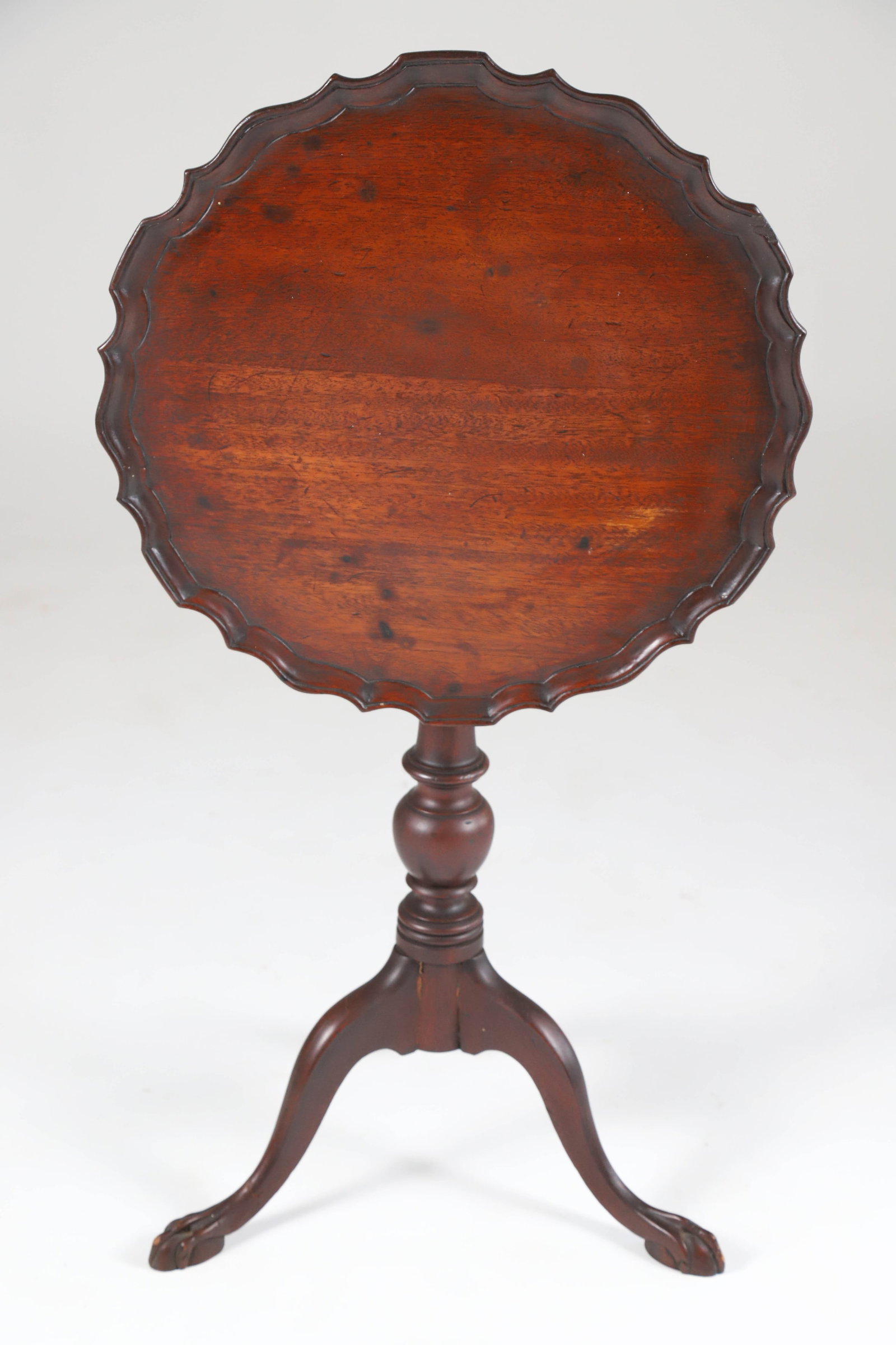 Chippendale Mahogany Pie Crust Tilt Top Tea Table, 19th Century: Chippendale Mahogany Pie Crust Tilt Top Tea Table, 19th Century, turned standard on three down swept legs ending in ball and claw feet 24.5 in. x 18 in. x 33.5 in.