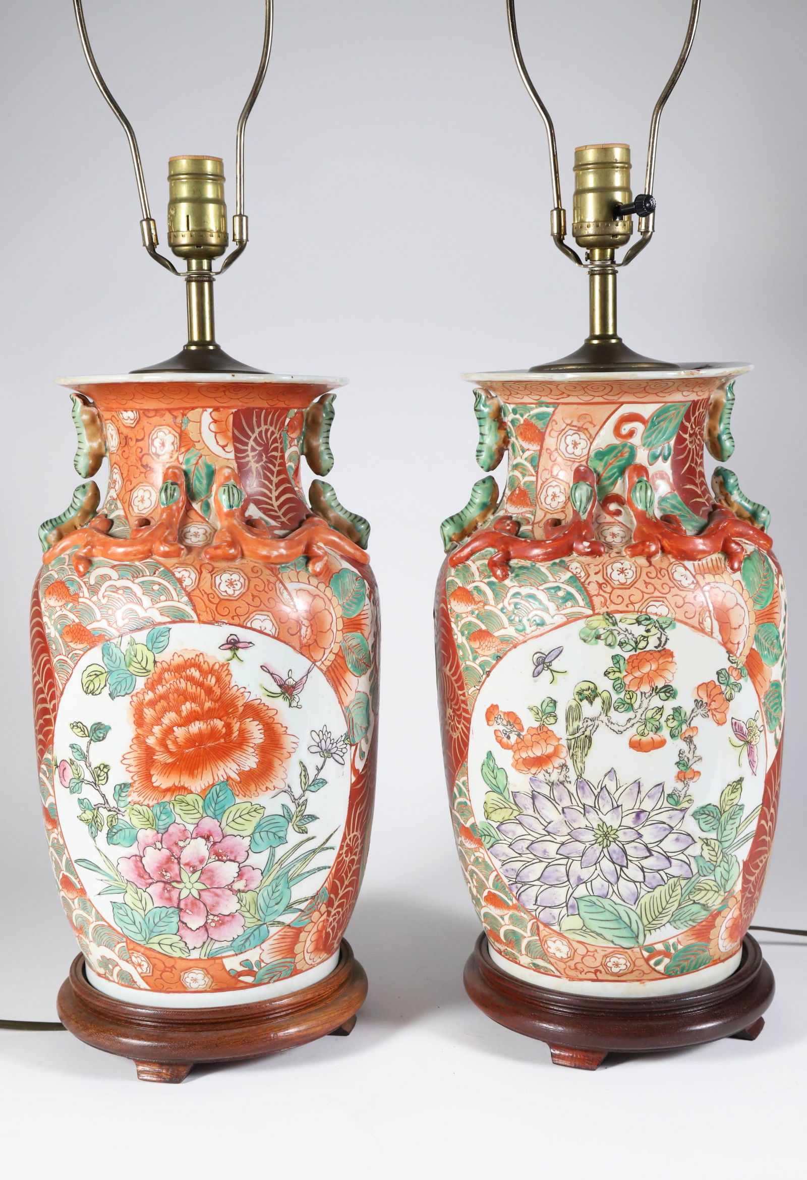 Pair of Chinese Porcelain Floral Decorated Lamps with Applied Caterpillars and Lizards: Pair of Chinese Porcelain Floral Decorated Lamps with Applied Caterpillars and Lizards, on teak wood bases Height 16 in.